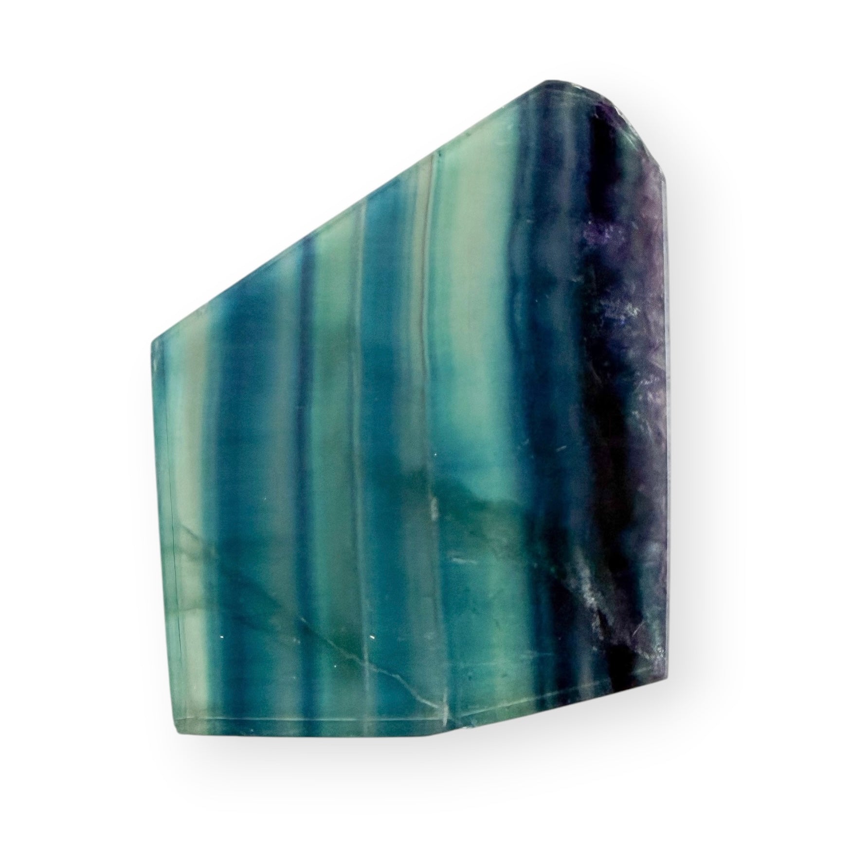 Polished Blue Green Fluorite slab featuring translucent aqua, teal, blue, and purple natural banding.