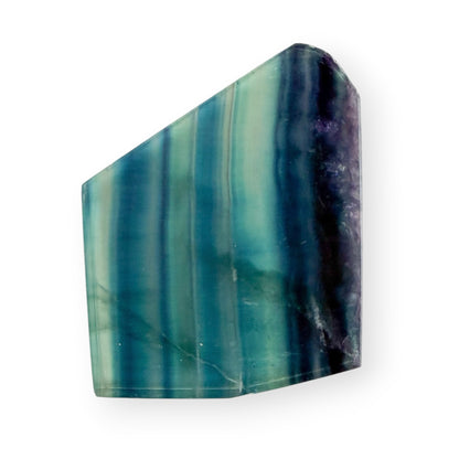 Polished Blue Green Fluorite slab featuring translucent aqua, teal, blue, and purple natural banding.