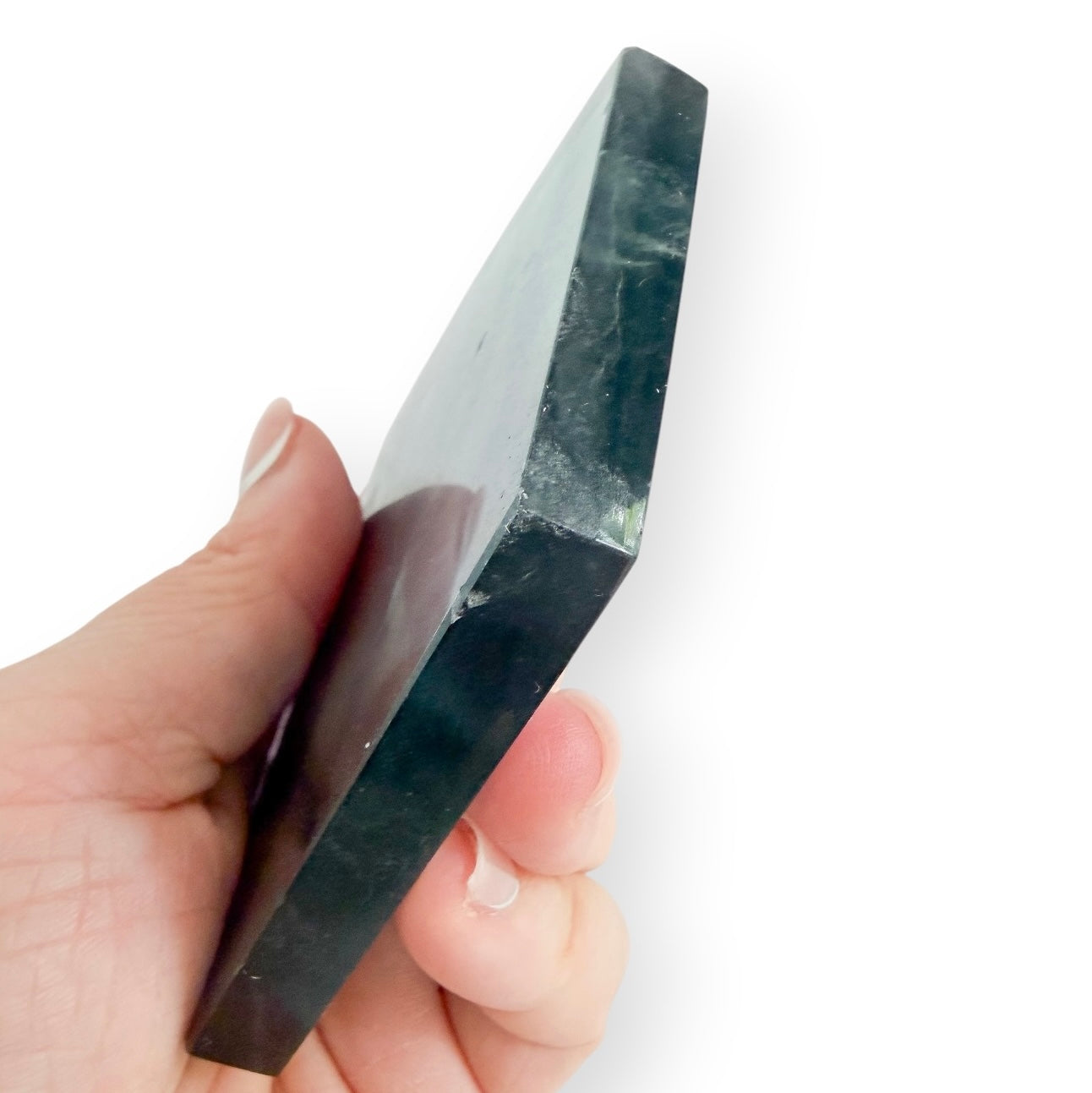 Side view of a polished Blue Green Fluorite slab showing natural layers and translucency.