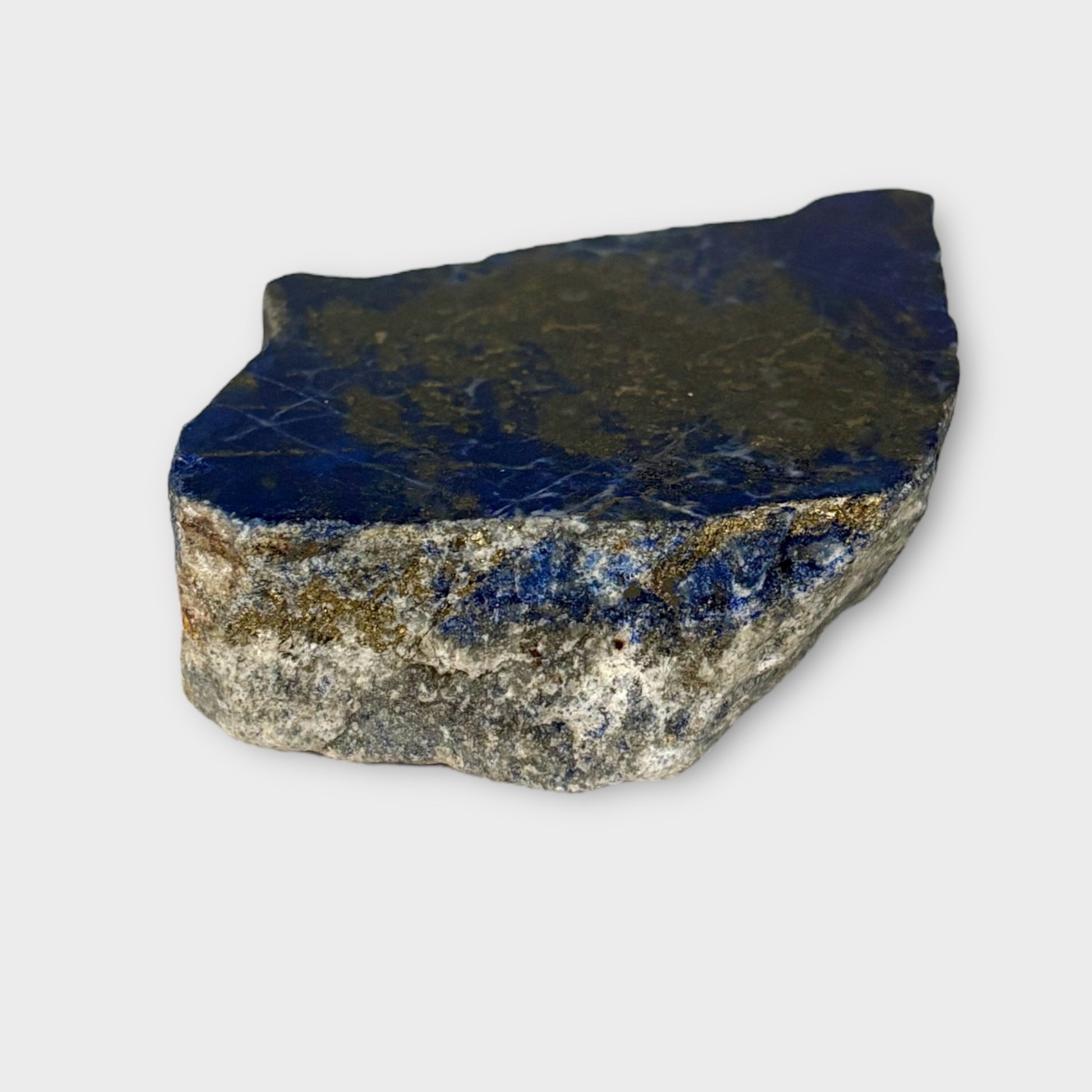 Side angle of Blue Lapis Lazuli slab showing layered crystal structure