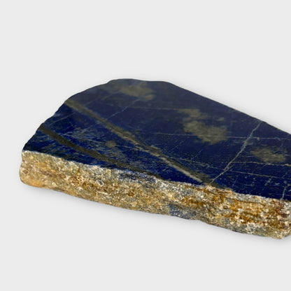 Close-up of Blue Lapis Lazuli crystal slab with white and gold streaks