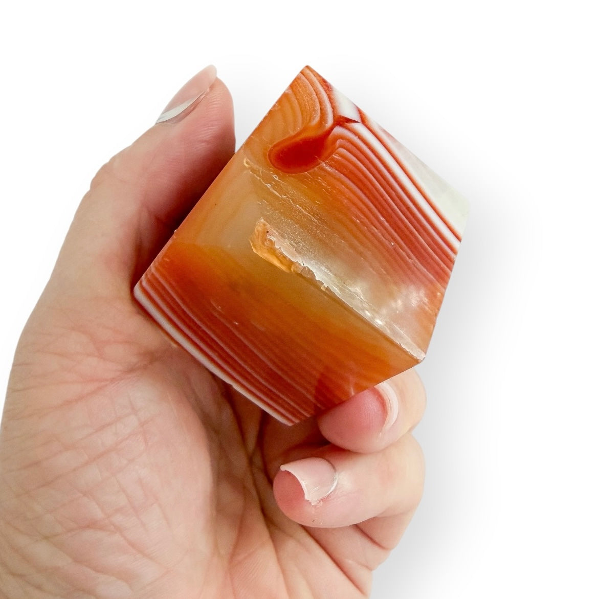Handheld Carnelian Agate display cube featuring natural agate banding and a polished finish.