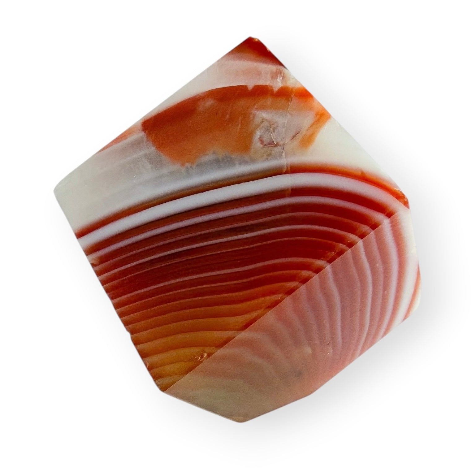 Carnelian Agate self-standing cube showing layered orange and white fortification-style banding.