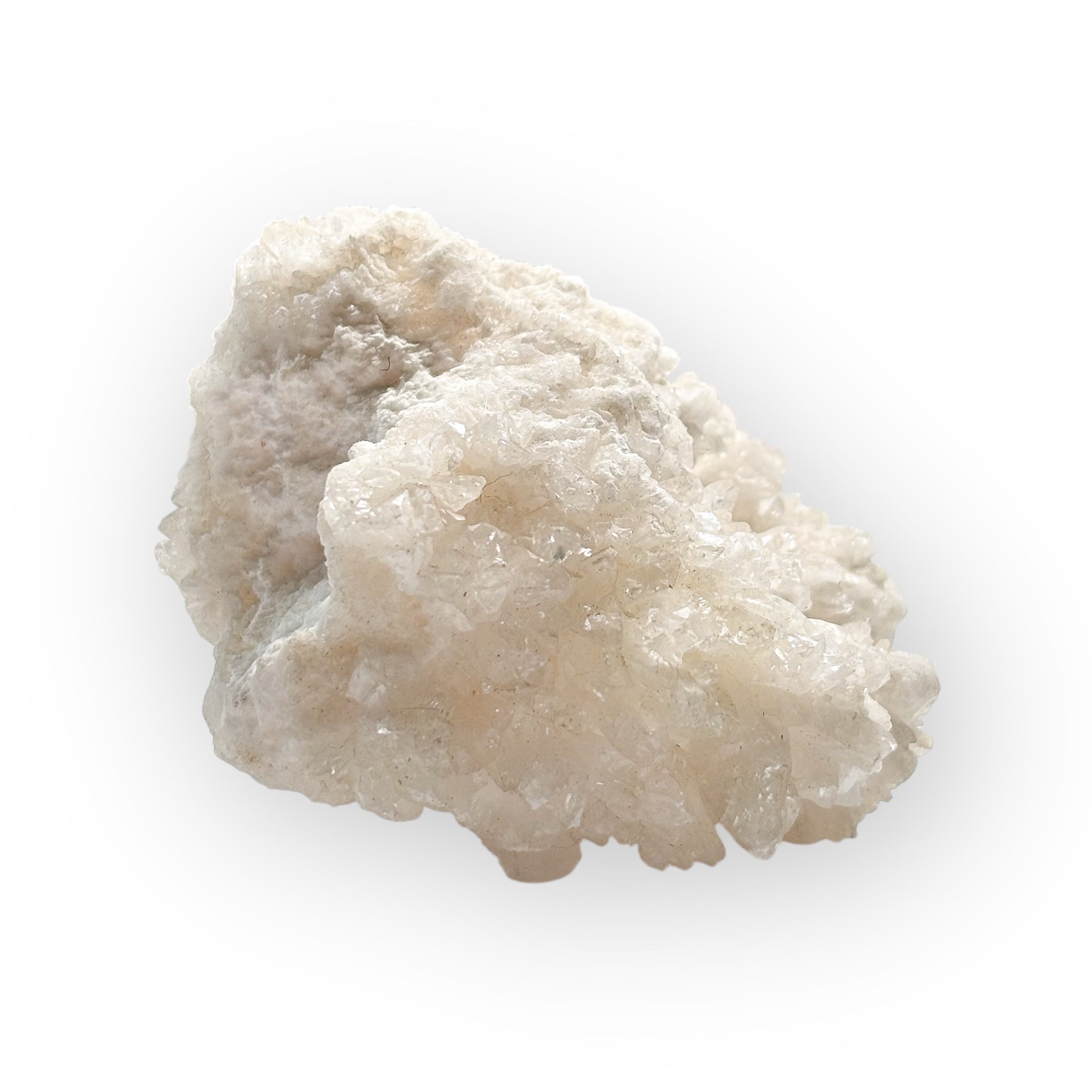 Close-up of a Cave Calcite (Aragonite) crystal cluster showing its soft white points and natural sparkle.
