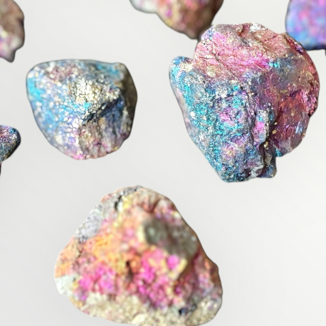 Iridescent Peacock Ore crystal displayed on white background
