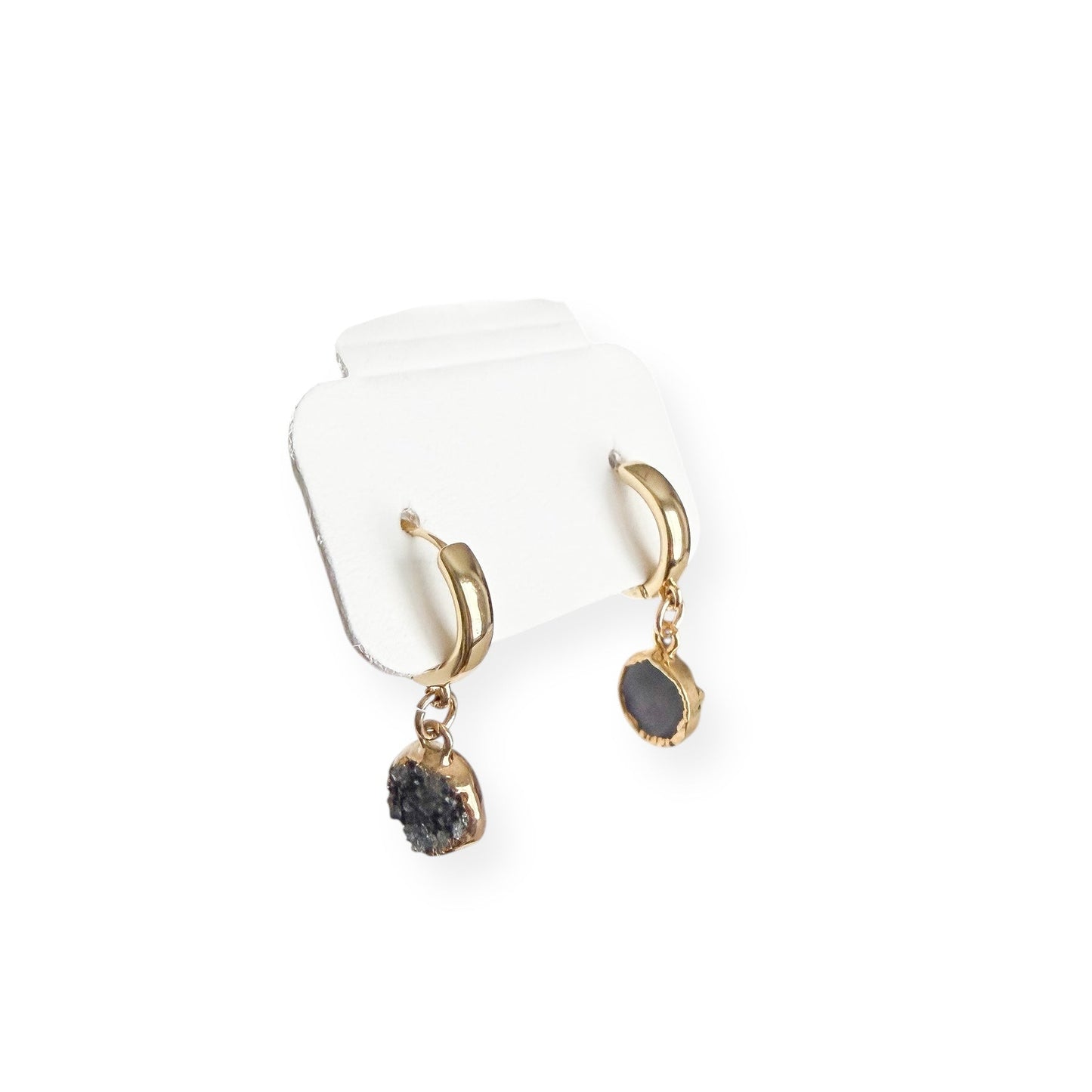 Close up of round drusy crystal drop on gold filled huggie earring showing natural sparkle and texture