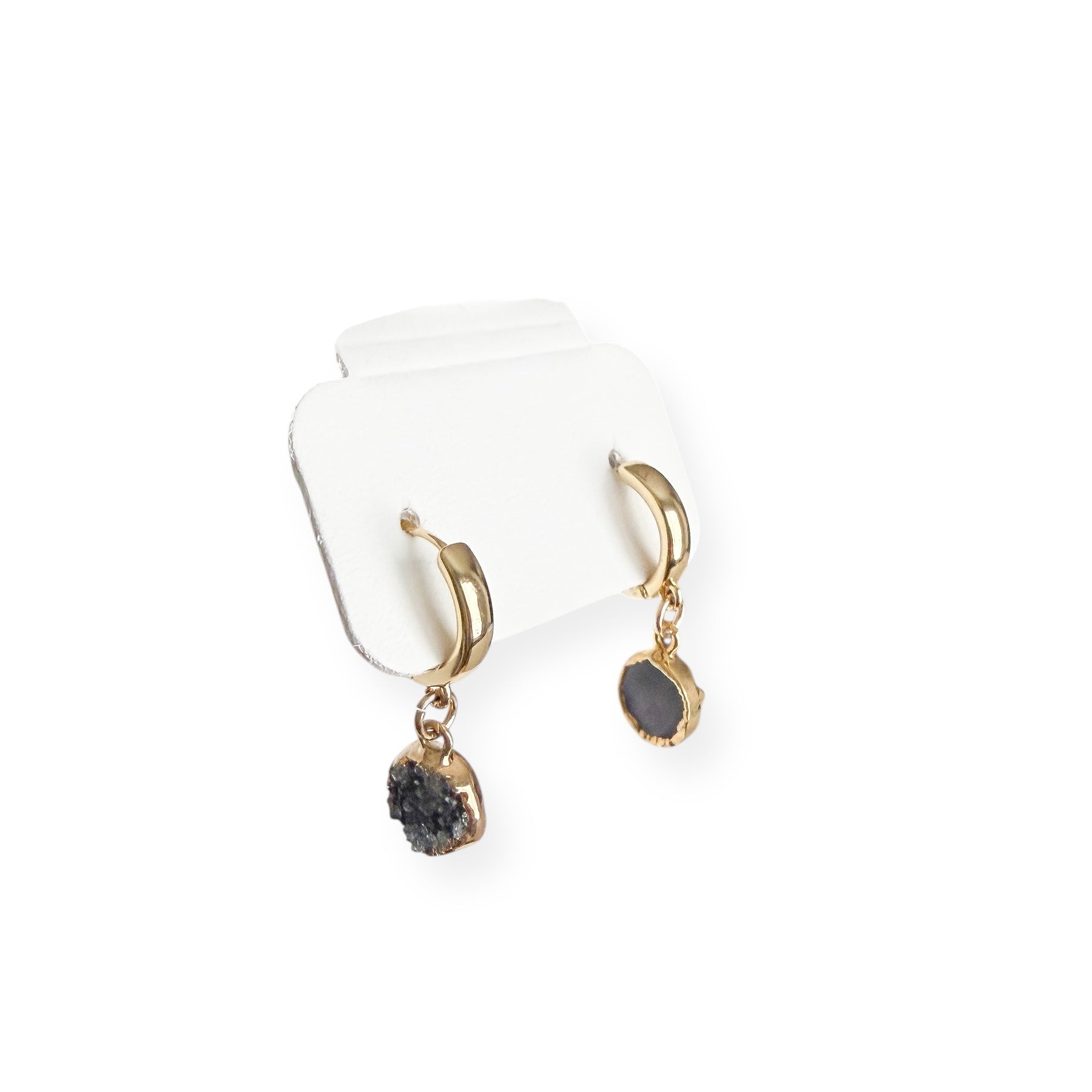 Close up of round drusy crystal drop on gold filled huggie earring showing natural sparkle and texture