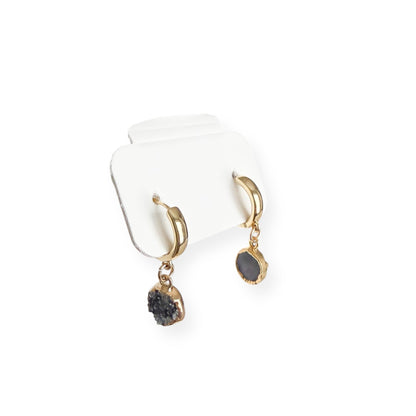 Close up of round drusy crystal drop on gold filled huggie earring showing natural sparkle and texture