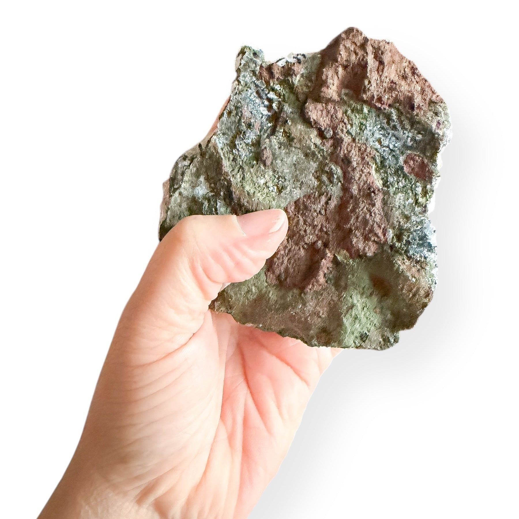 Hand holding a citrine crystal cluster to show size and detail.