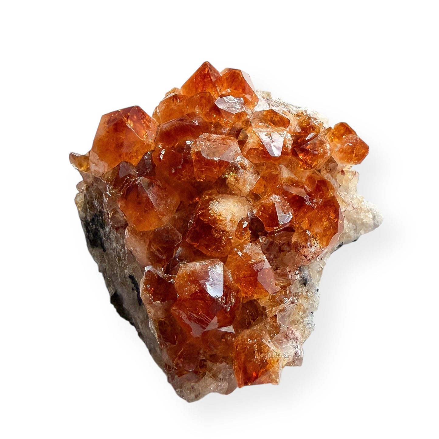Side view of citrine crystal cluster showing raw matrix base and crystal points.