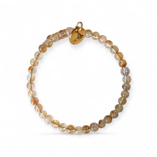 Flexible stainless steel Citrine Natural crystal bracelet with 4mm beads on a white background.