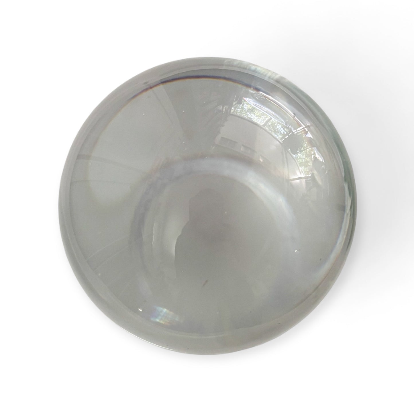 Clear glass crystal sphere on white background