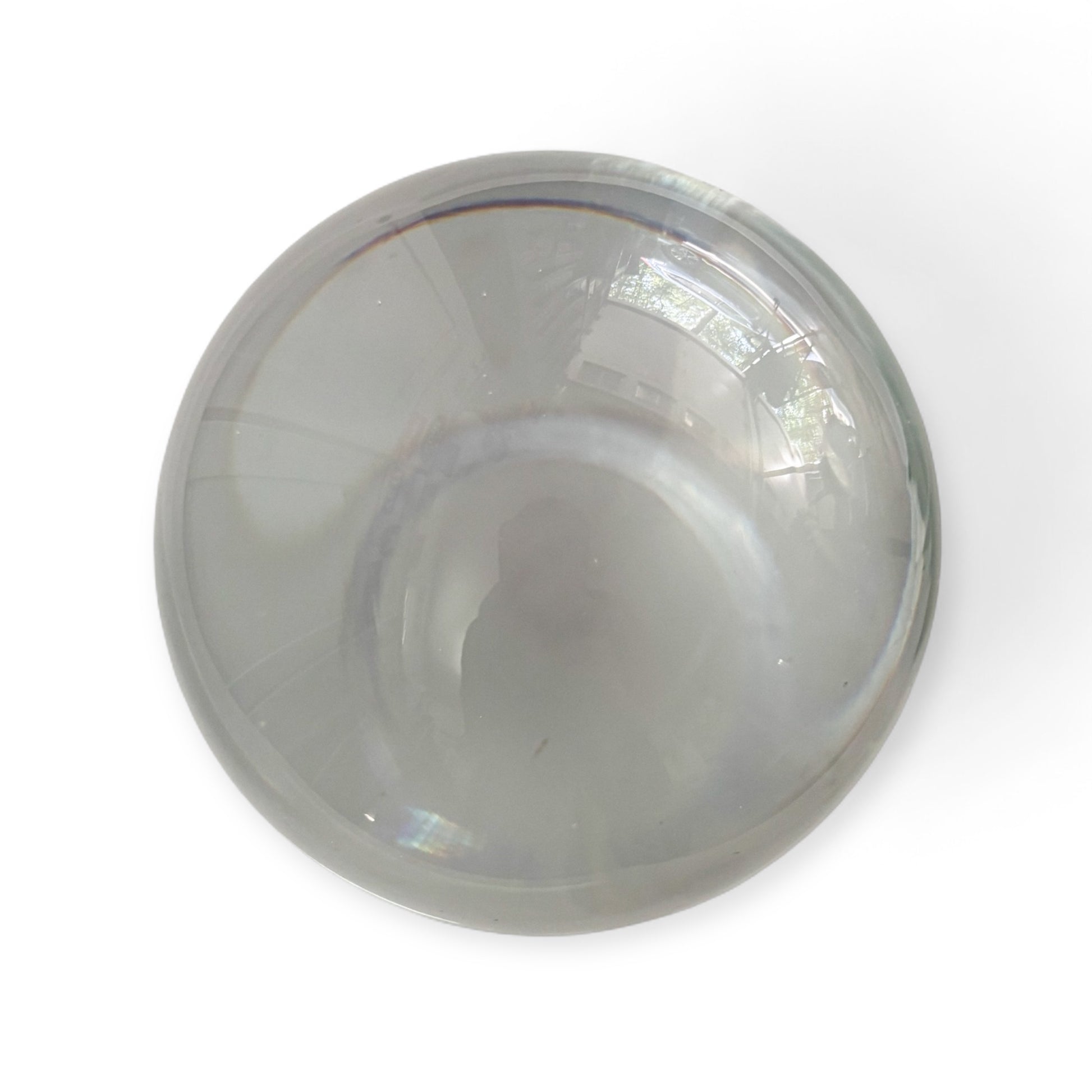 Clear glass crystal sphere on white background