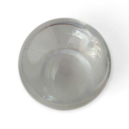 Clear glass crystal sphere on white background