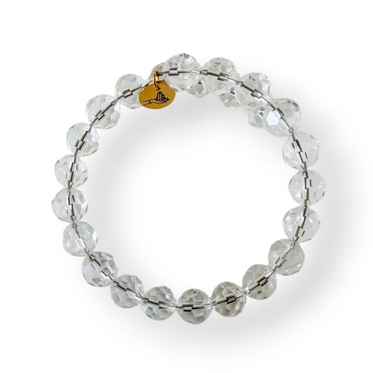 Top view of the Clear Quartz 10mm micro-faceted bracelet showing round faceted beads.