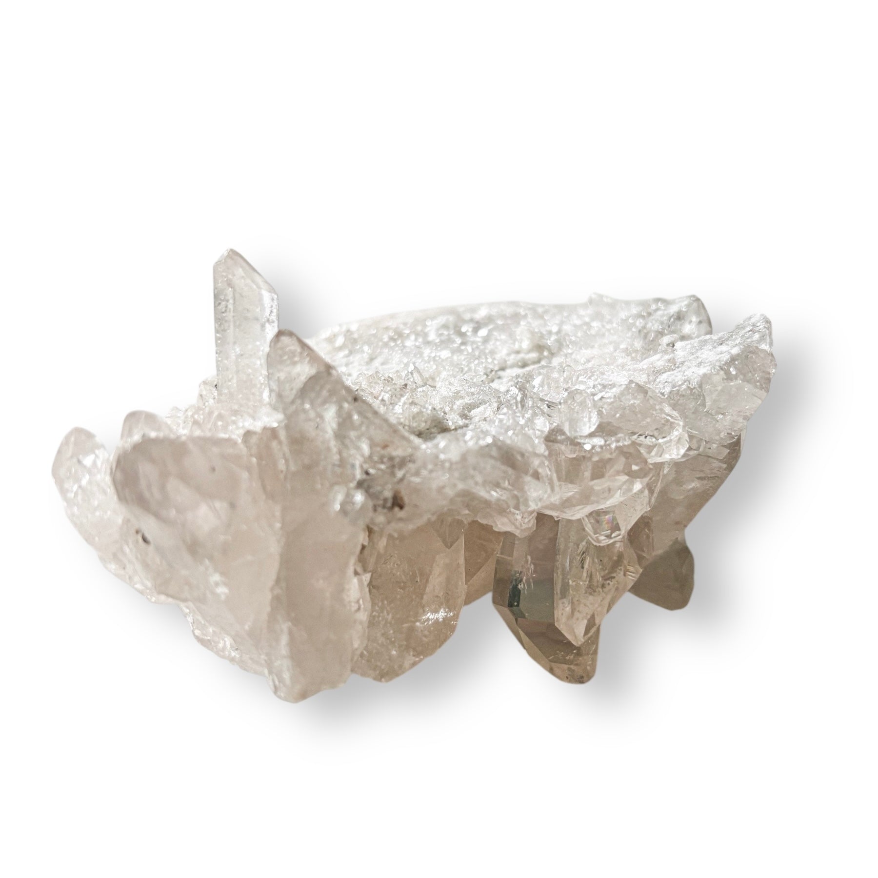 Clear Quartz Cluster displayed on white background with visible rainbow flash.
