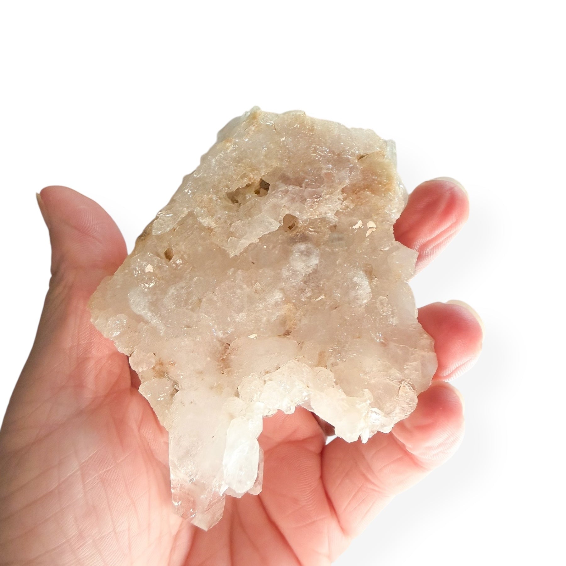 Hand holding medium Clear Quartz Cluster to show size and sparkle