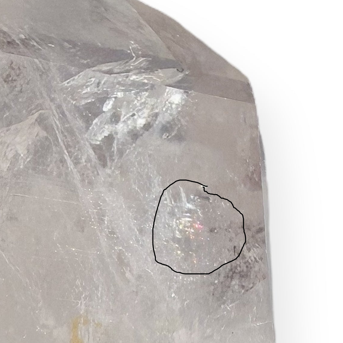 Close-up of rainbow inclusion inside Clear Quartz crystal