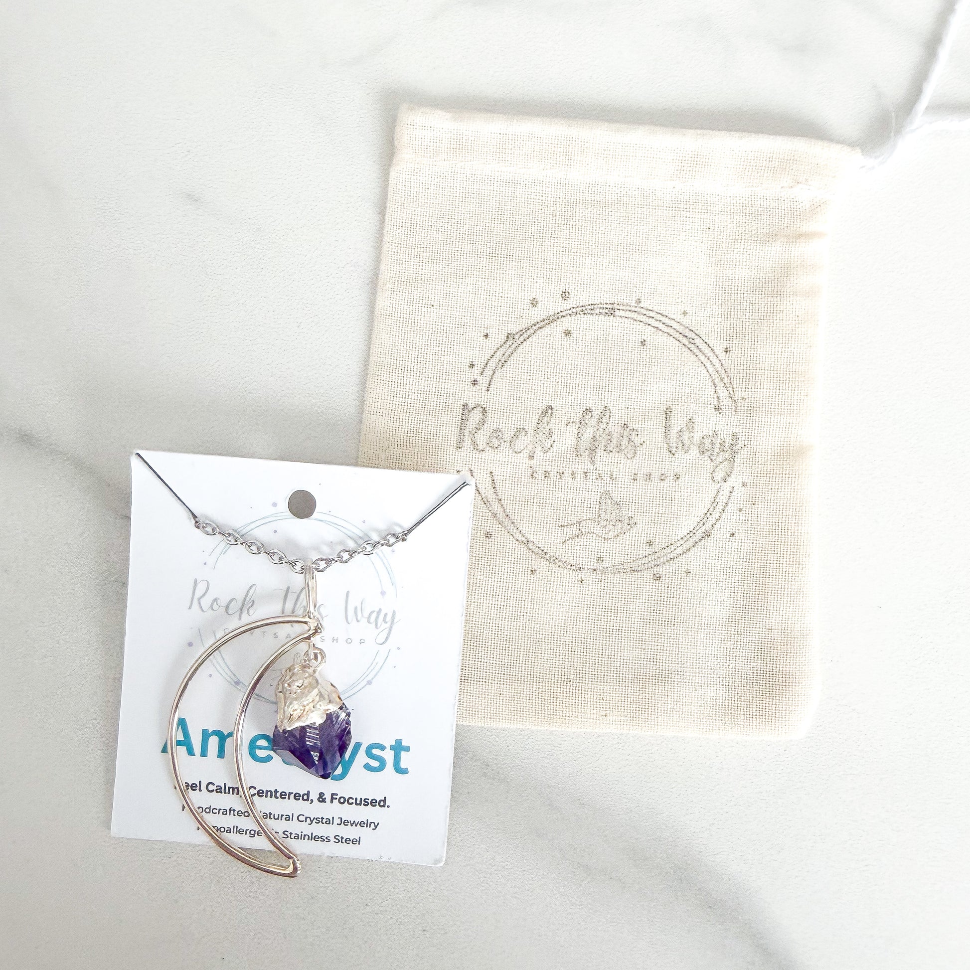 Crescent moon amethyst silver plated necklace packaged with polishing cloth from Rock This Way Crystal Shop