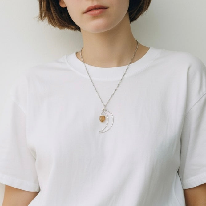 AI model wearing crescent moon citrine silver plated pendant necklace on stainless steel chain