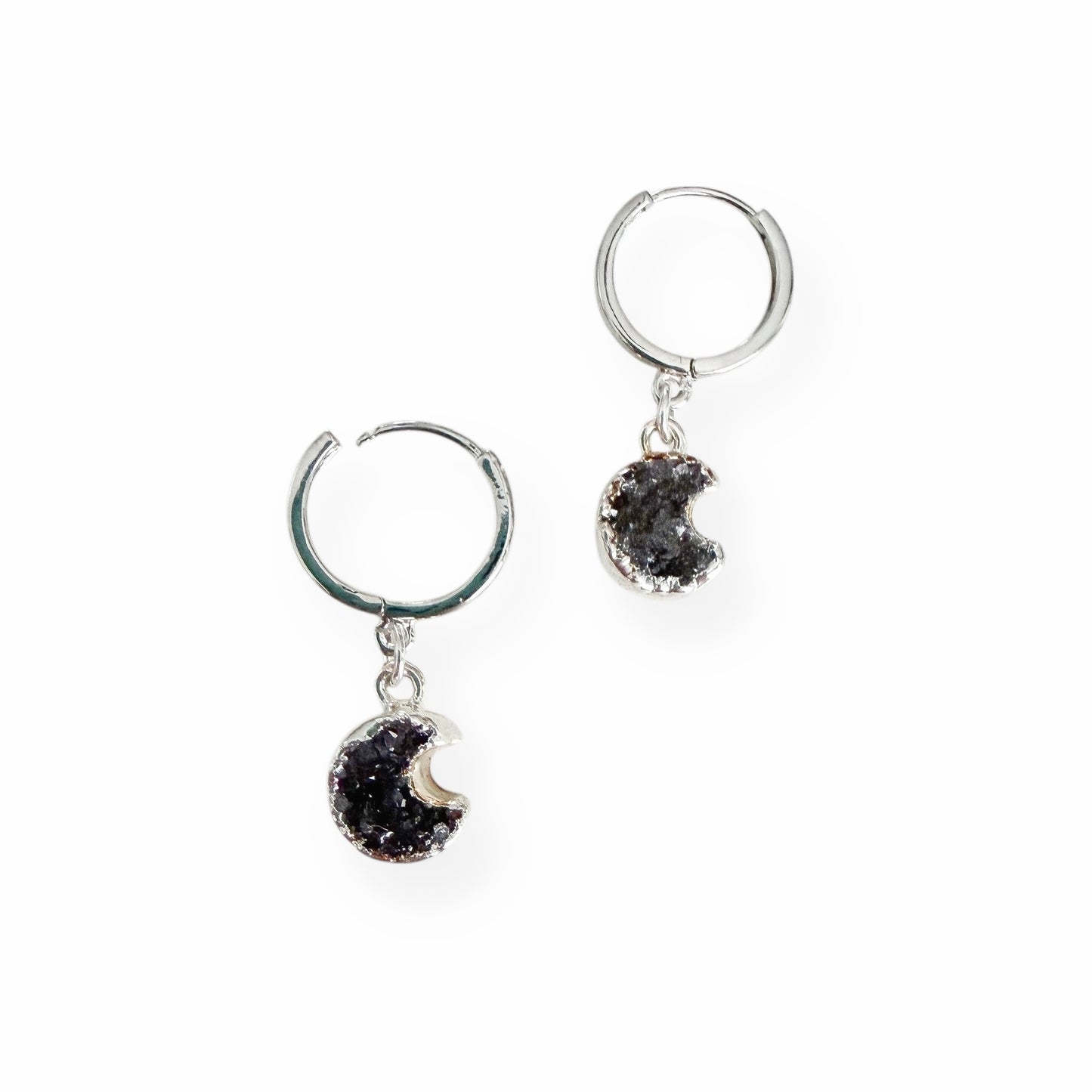 Crescent moon drusy huggie earrings in white gold filled metal on a white background
