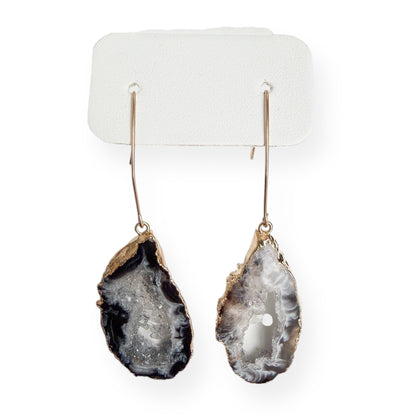 Close up of dark agate slice geode earrings showing natural banding and sparkling drusy texture
