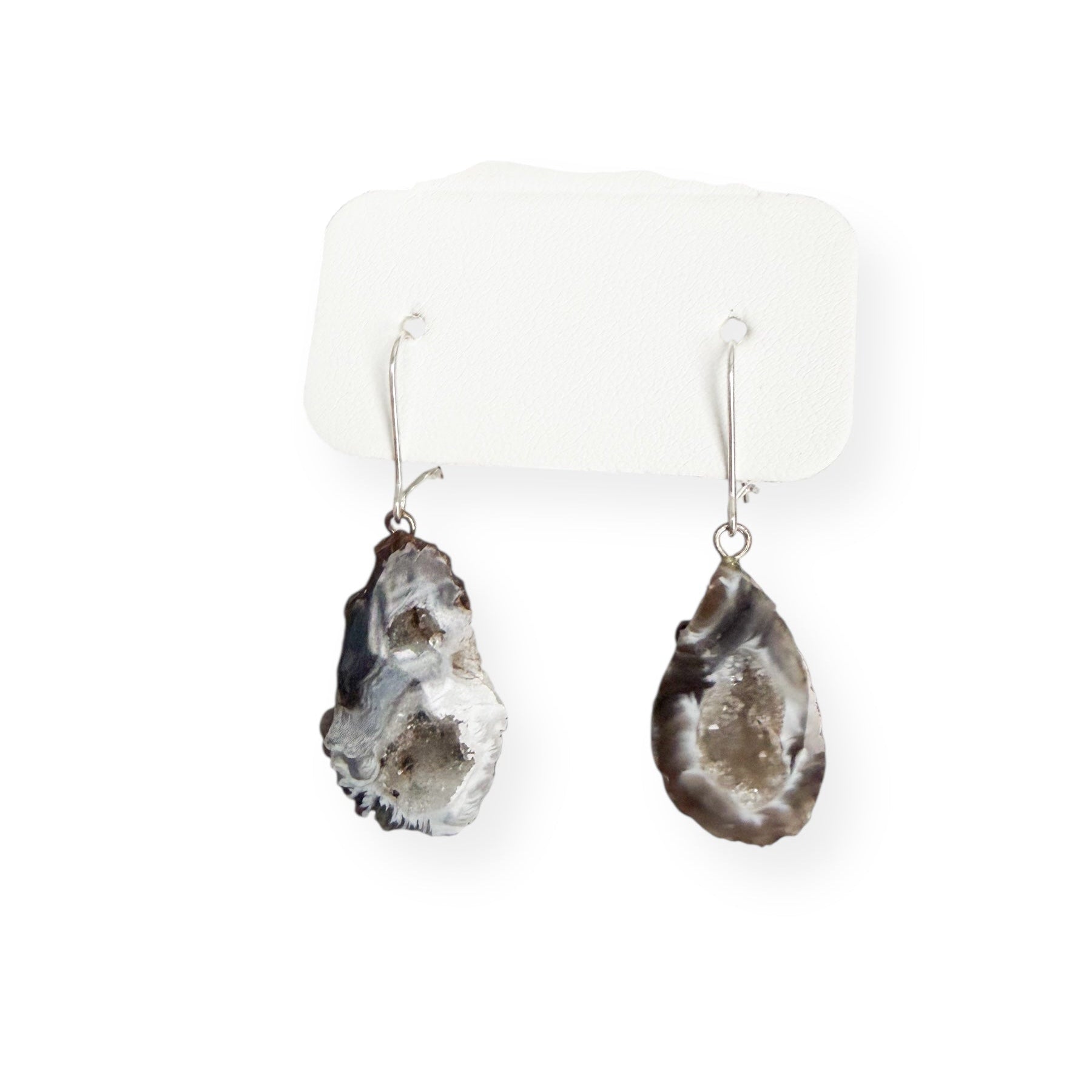 Close-up detail of dark geode drusy earrings showing sparkling crystal texture and natural stone edges with sterling silver kidney ear wires