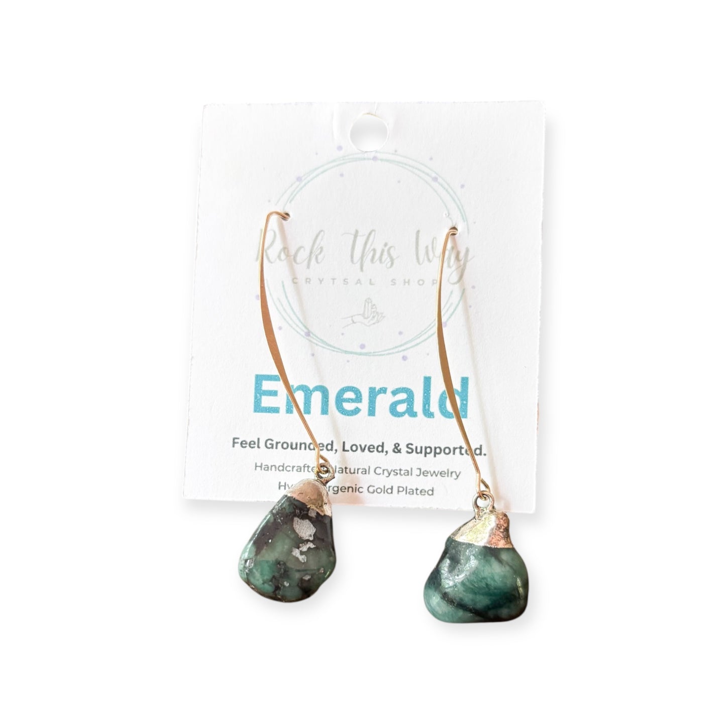 Close-up of raw Emerald Drop Earrings on Rock This Way jewelry card.