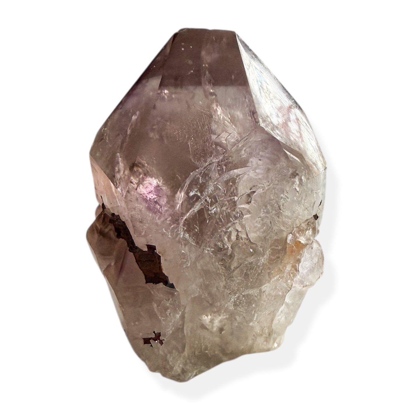 Natural amethyst point showing raw texture and polished top