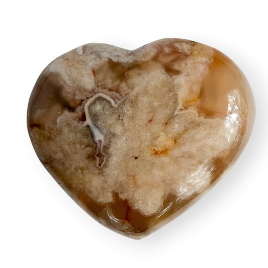 Polished Flower Agate heart from Madagascar featuring cream-colored floral plume formations in translucent peach chalcedony.