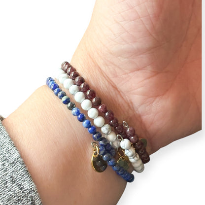 Freedom Stack fits on wrist with stainless steel flexible band, Red, White, and Blue
