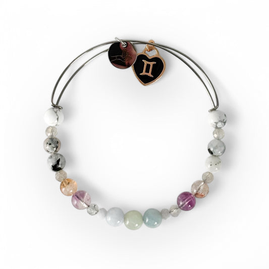 Gemini Crystal Charm Bracelet with a black charm, featuring Aquamarine, Blue Lace Agate, Labradorite, Fluorite, Citrine, Moonstone, and Howlite for intuition and expression.