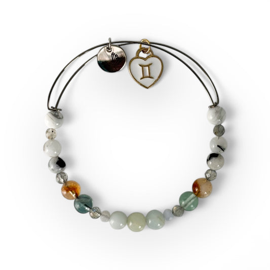 Gemini Crystal Charm Bracelet with a white charm, handcrafted with Aquamarine, Blue Lace Agate, Labradorite, Fluorite, Citrine, Moonstone, and Howlite for clarity and creativity.
