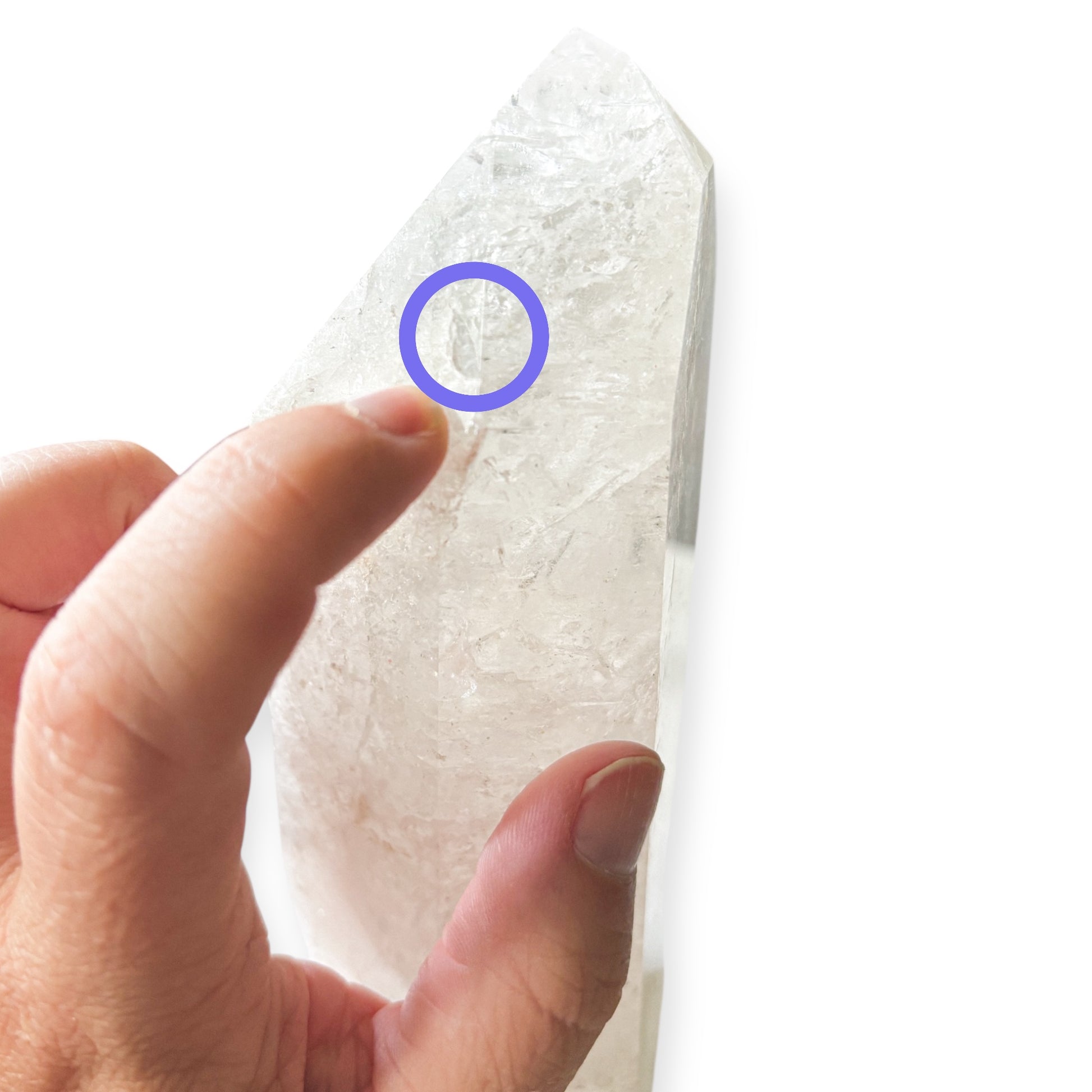 Detail of small chip on the point of Girasol Quartz Tower, circled for visibility.