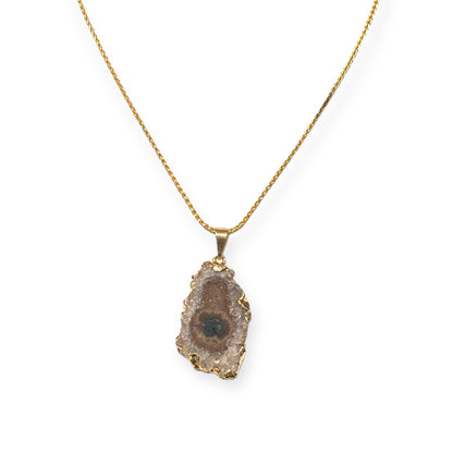 Front view of gold amethyst stalactite necklace with raw crystal slice on gold chain