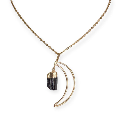 Gold plated crescent moon pendant necklace with natural black tourmaline crystal on a PVD gold plated stainless steel chain.