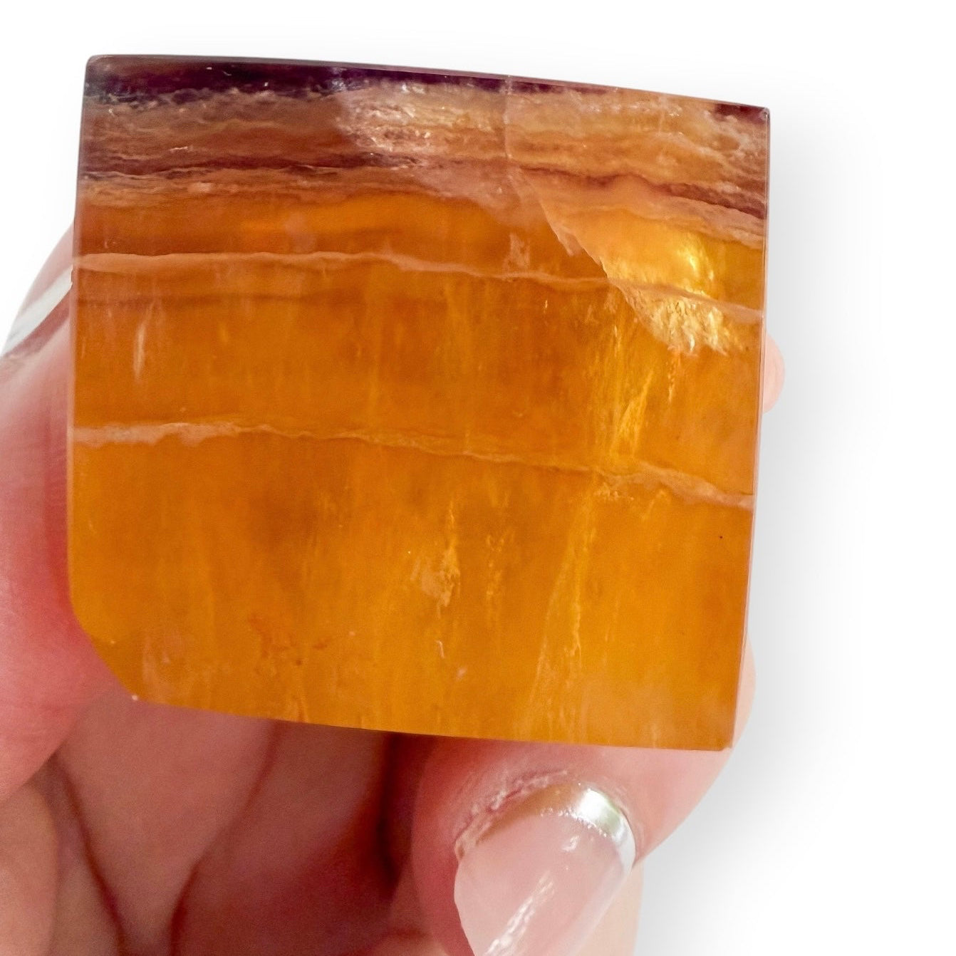 Golden Fluorite crystal freeform displaying natural amber banding, honey tones, and internal crystal formations.