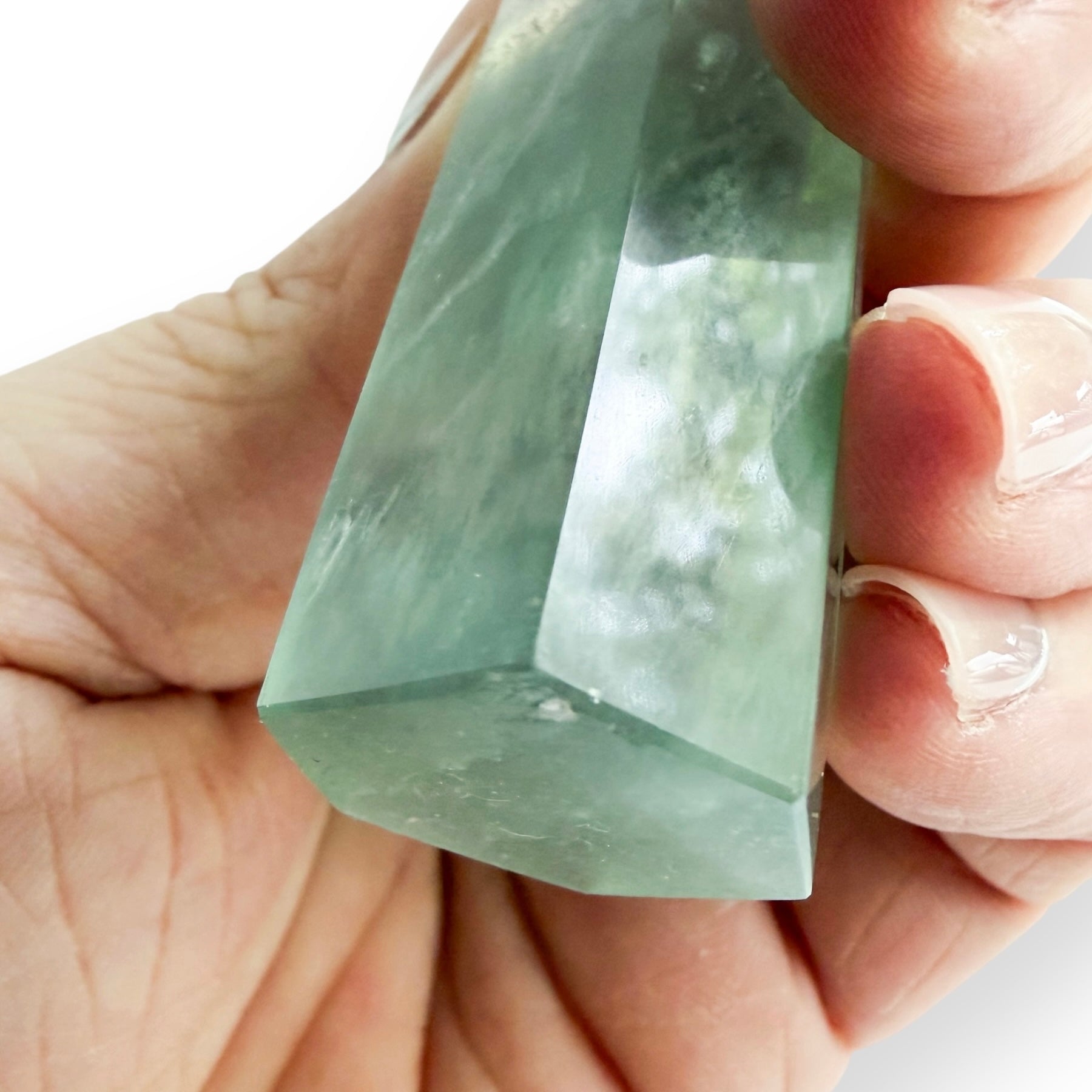 Polished green and purple Fluorite crystal tower