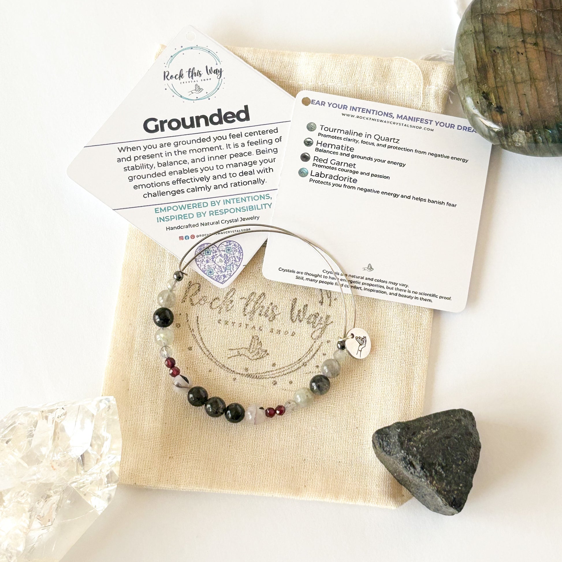 Grounded crystal bracelet styled with neutral outfit, showing bracelet stack and natural colors