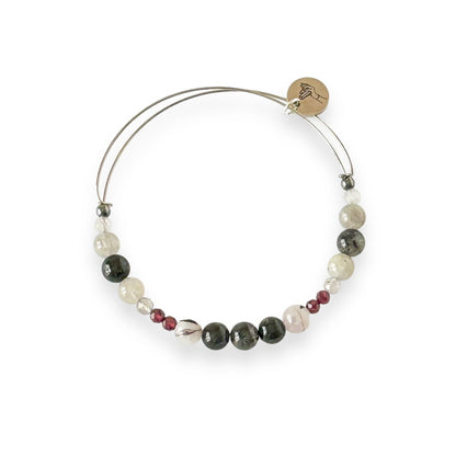 Grounded Crystal Bracelet bangle with garnet, labradorite, and hematite on a stainless steel band