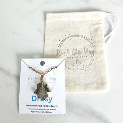 Gold plated Hamsa drusy hand pendant necklace displayed on Rock This Way Crystal Shop packaging, ready for gifting.