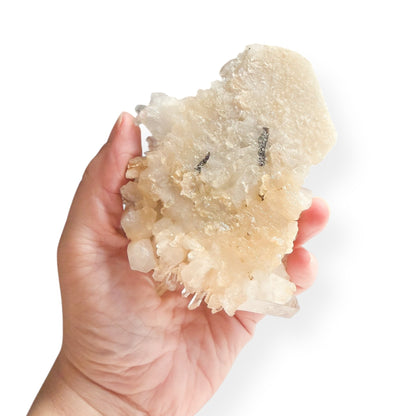 Hand holding large Clear Quartz Cluster to show size and structure