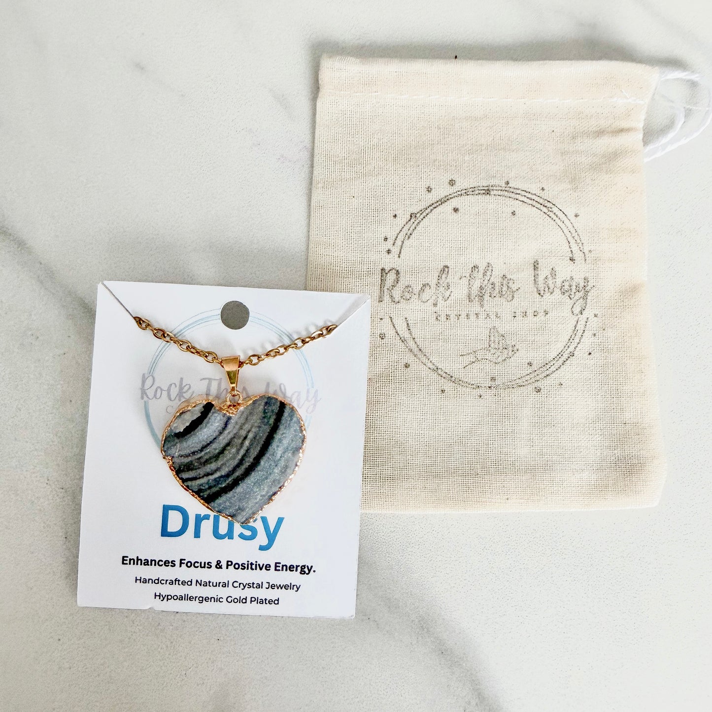 Gold plated heart drusy pendant necklace displayed on Rock This Way Crystal Shop packaging, ready for gifting.