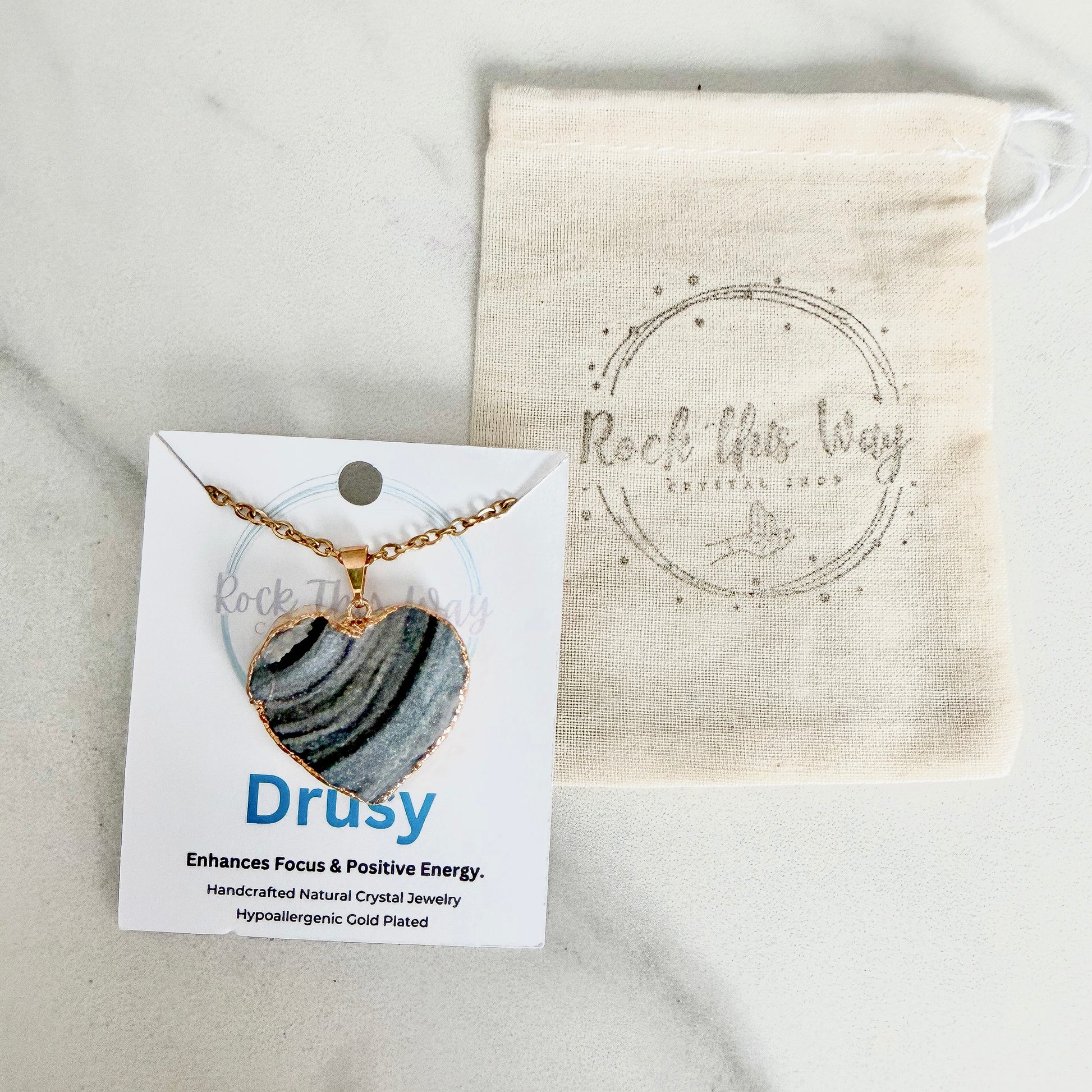 Gold plated heart drusy pendant necklace displayed on Rock This Way Crystal Shop packaging, ready for gifting.