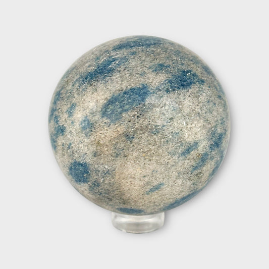 Polished K2 Jasper Sphere resting on clear acrylic stand