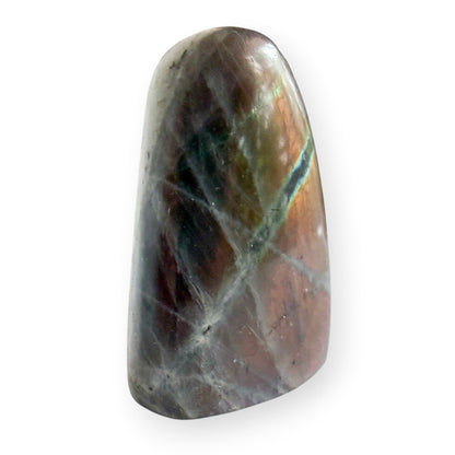 Polished Labradorite free form displaying subtle purple, pink, and gold flash across the front.