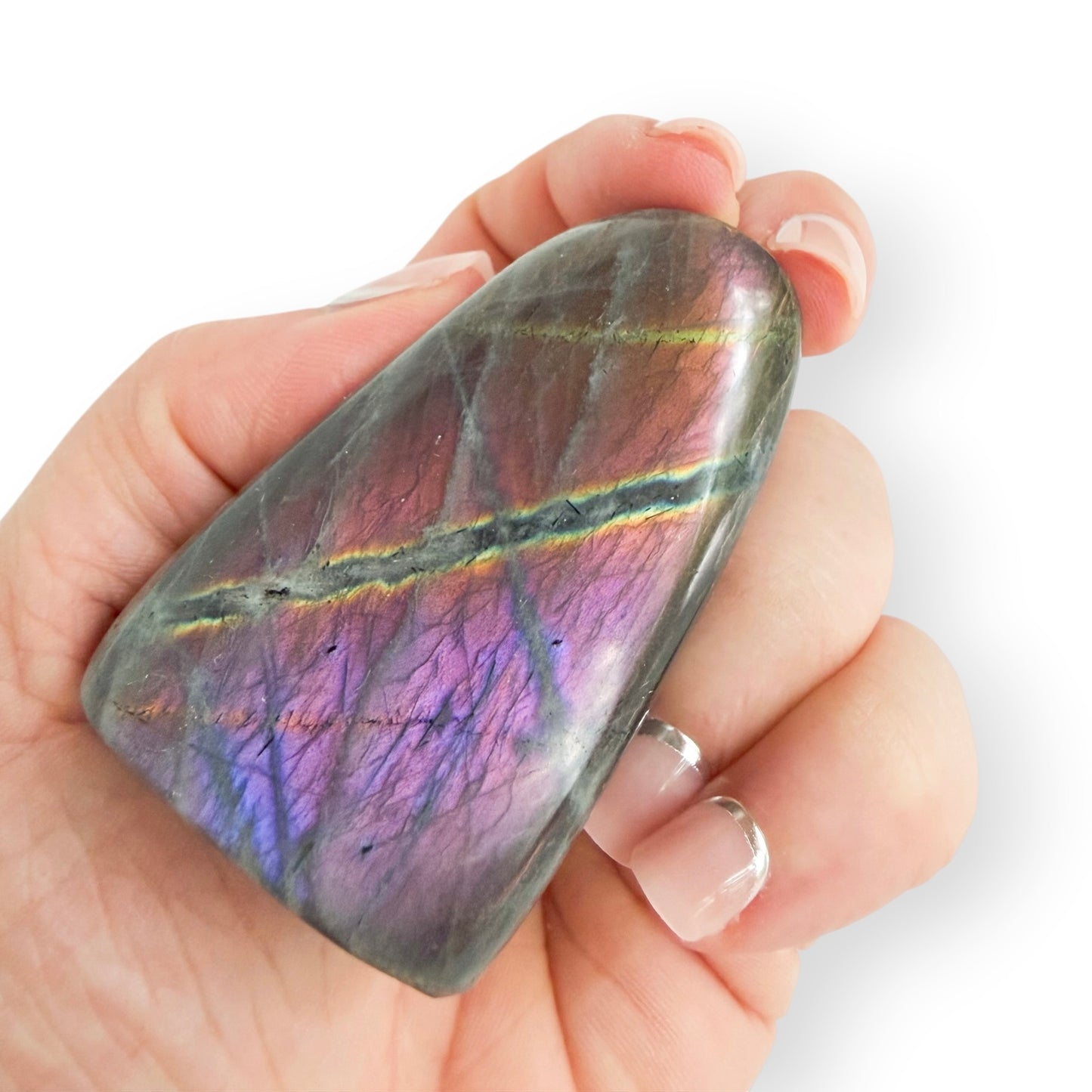 Labradorite free form showing vibrant purple, pink, gold, and blue labradorescence under changing light.