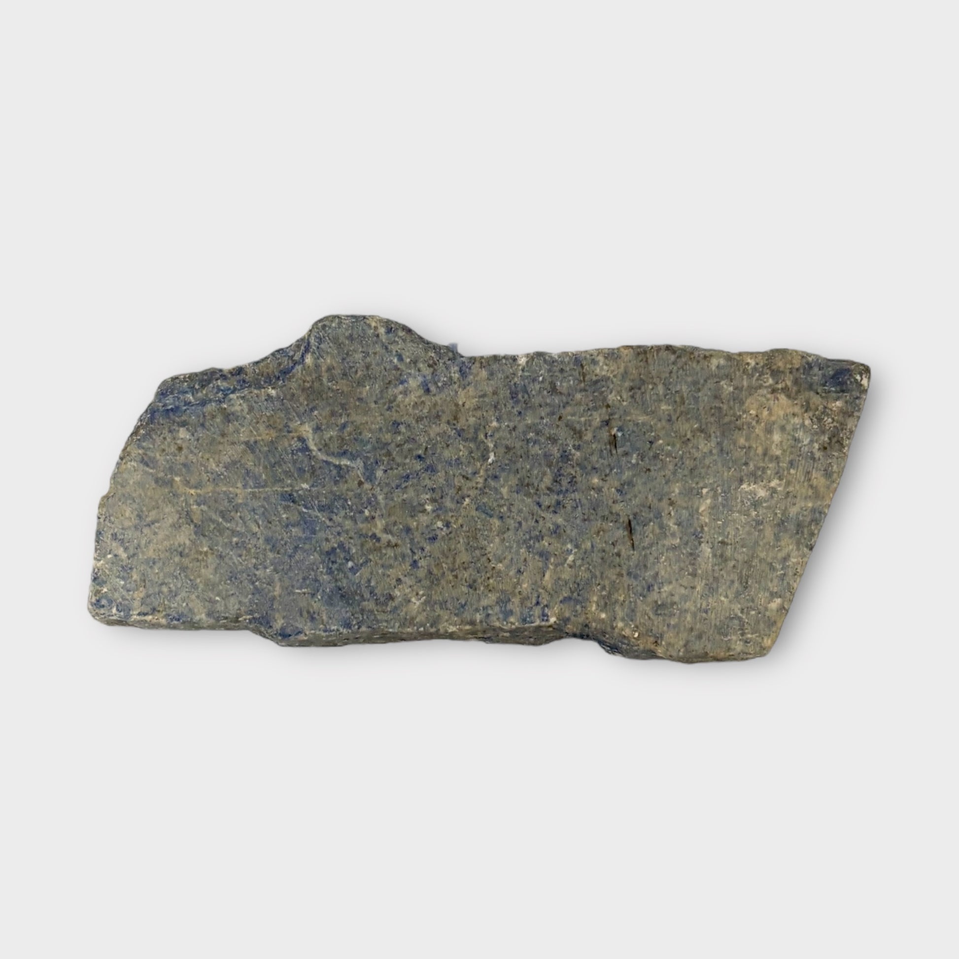 Raw back of Lapis Lazuli slab with natural earthy stone surface