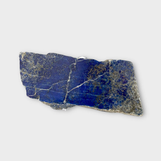 Polished Lapis Lazuli blue crystal slab with natural lines and golden flecks