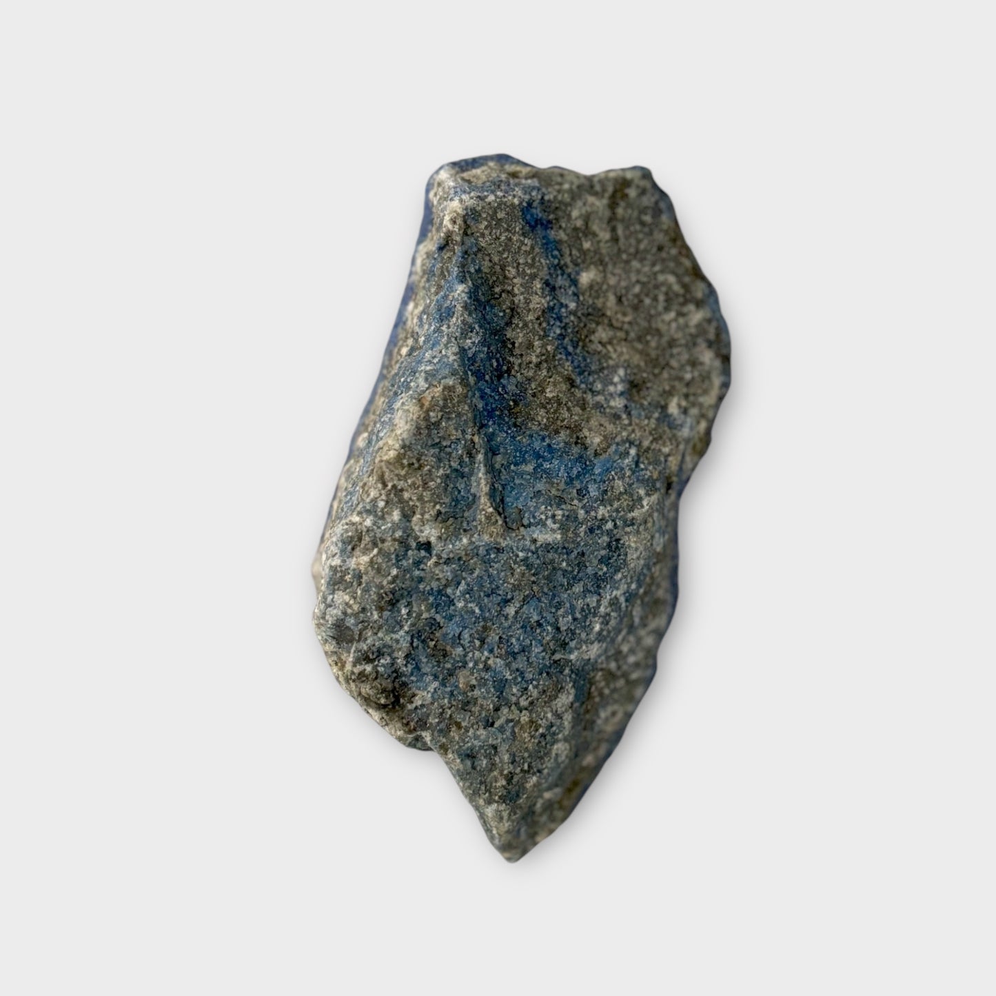 Back side of raw Lapis Lazuli slab with natural stone texture